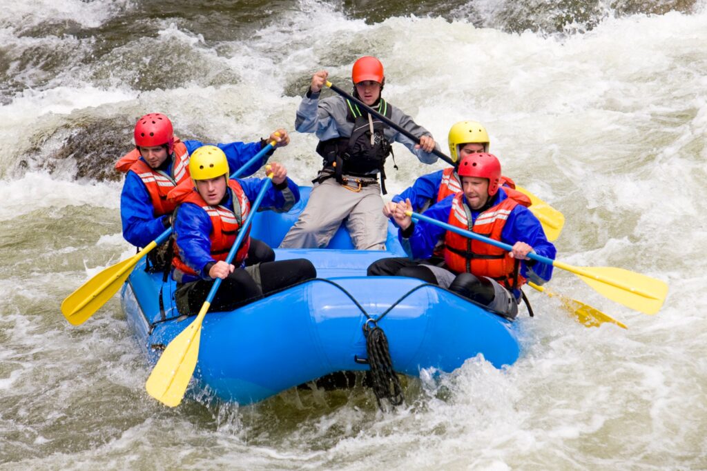 Group of four people with guide river rafting in Buena Vista, Colorado USA.
