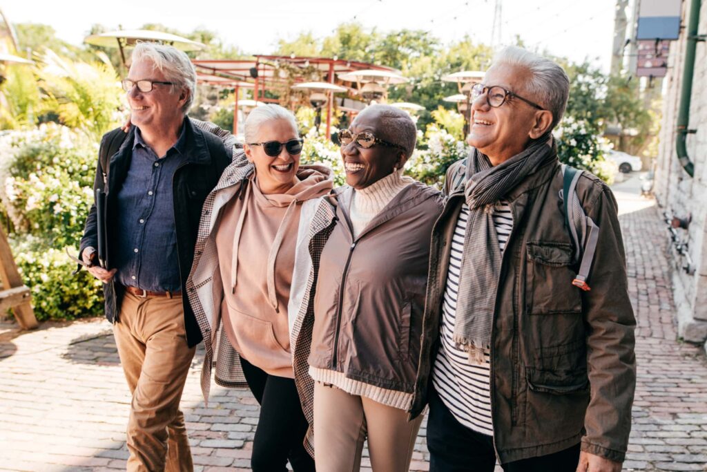 Active seniors vacationing and walking in the city